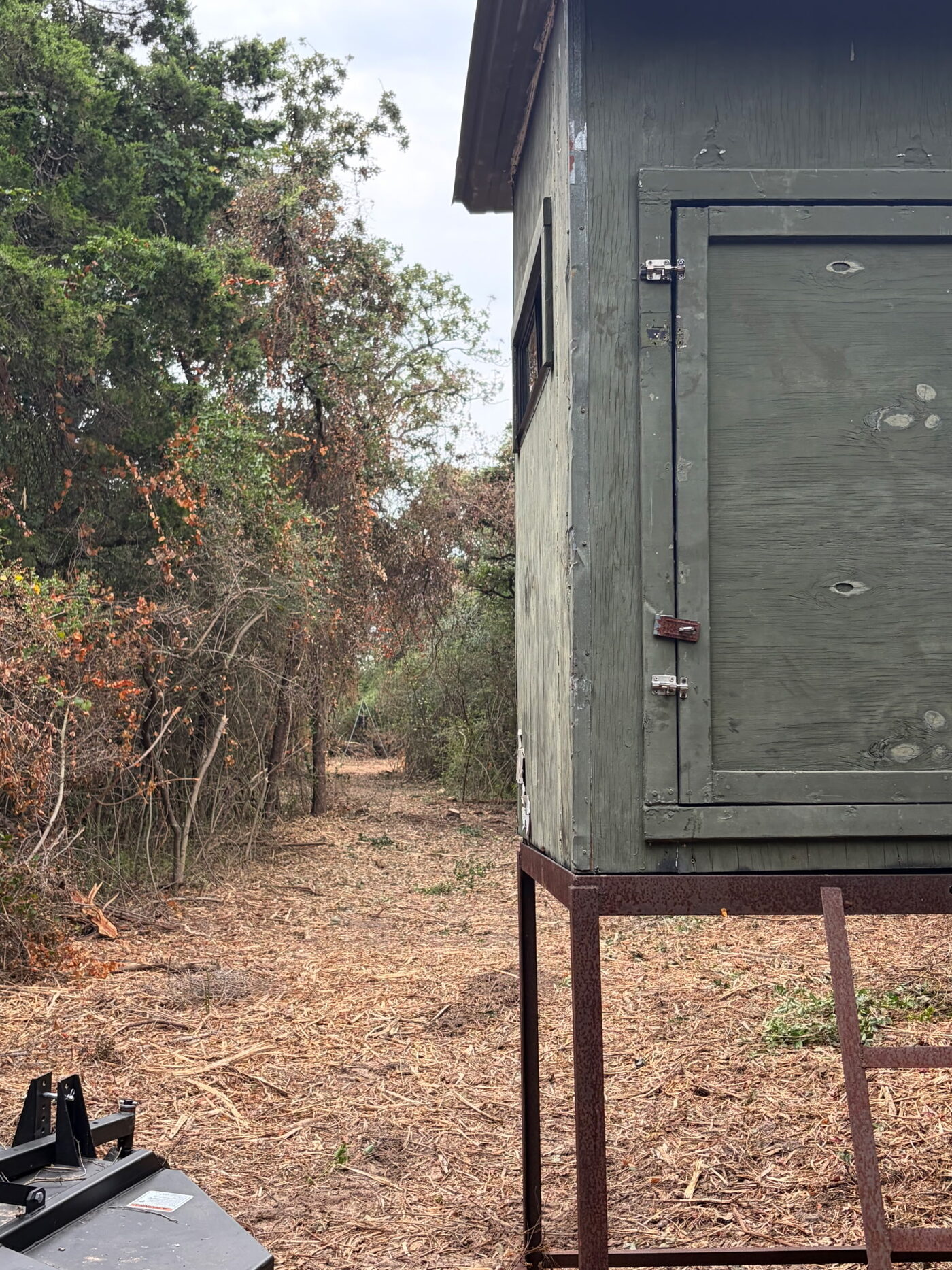 Deer blind with a freshly cleared lane in front of it