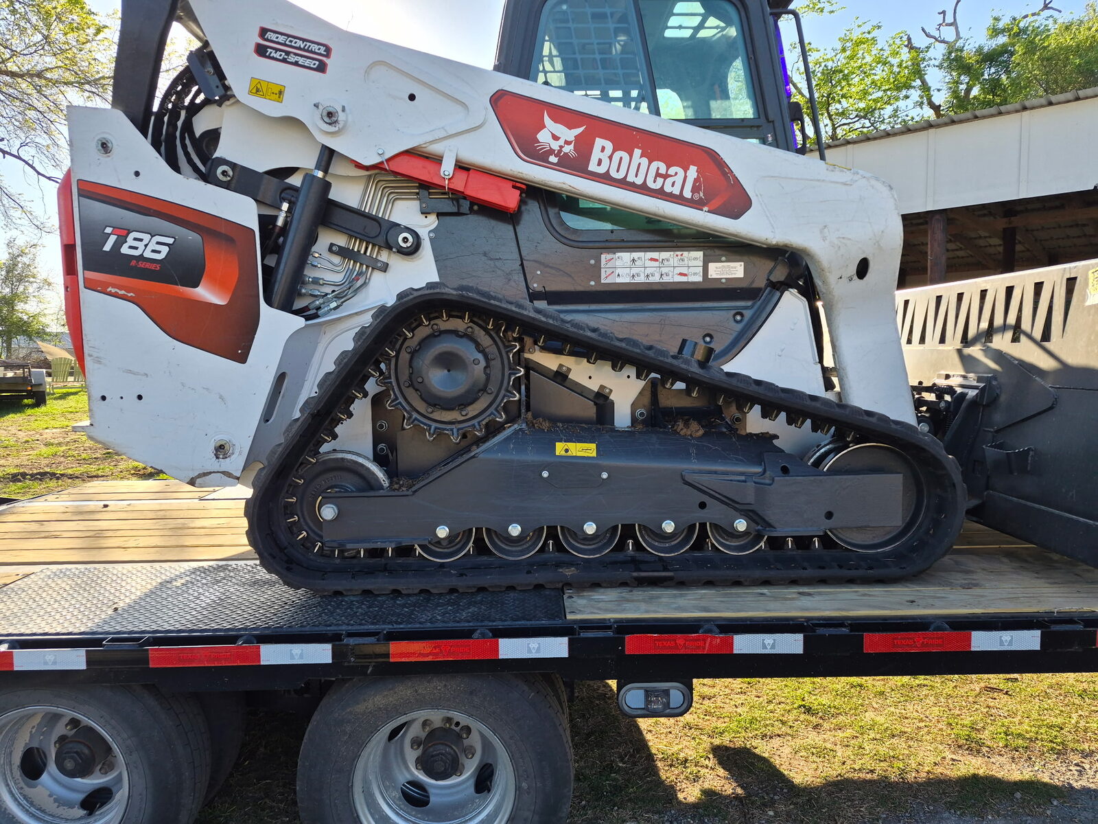 Bobcat T86 compact track loader on a gooseneck trailer